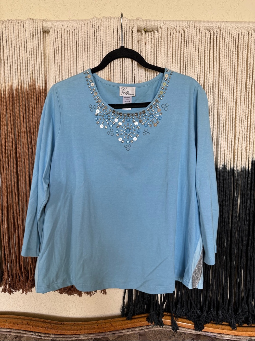 Light baby blue G Unit Fashions 3/4 sleeve top with an embellished neckline